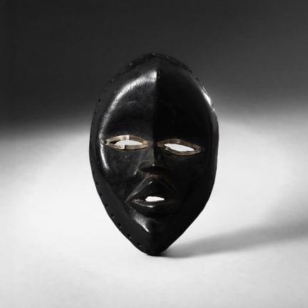 Dan, Ivory Coast - Mask. Wood with black patina, m