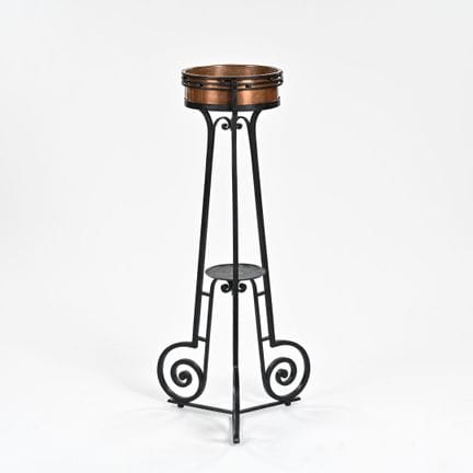 WORK 1930

A planter with three interconnected leg