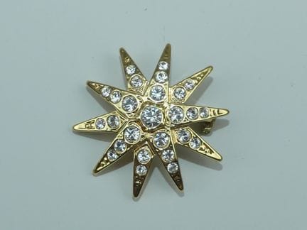 AGATHA. Goldene Sternbrosche mit Strasssteinen ver