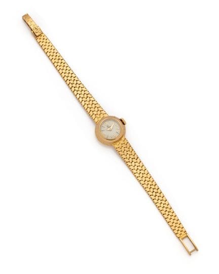 OMEGA 
BRACELET MONTRE ronde de dame en or jaune (