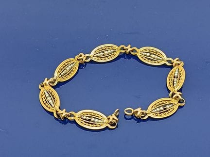 Bracelet en or jaune 750‰ à mailles ajourées et re