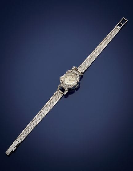 Montre bracelet de soirée en or gris 750‰ sertie d