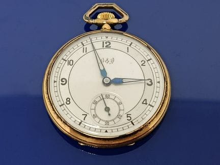 Montre de gousset en or et argent de marque POP. 
