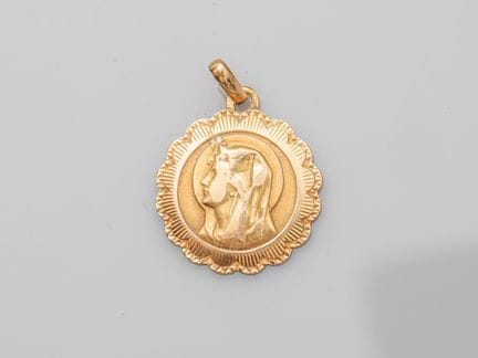 Religious medal in 750°/°° (18K) gold, with an une
