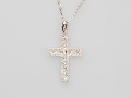 750°/°° (18K) white gold cross, set with baguette-