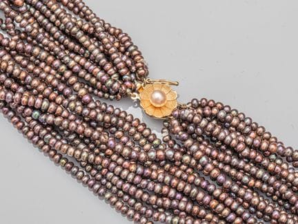 Braided necklace consisting of 12 rows of small, d
