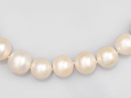 A large cultured pearl necklace with cascading pea