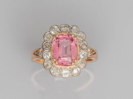 Two-tone gold daisy ring, set with a beautiful rec