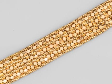 750°/°° (18K) yellow gold ribbon bracelet with a b