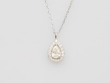 Platinum teardrop pendant, set with a pear-shaped 