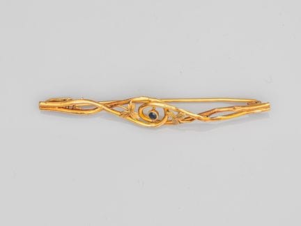 Brosche aus zweifarbigem 750°/°° (18 K) Gold mit e