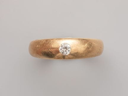 Herrenring aus 750°/°° (18 K) Gelbgold, besetzt mi