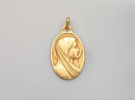 Large oval religious medal in 750°/°° (18K) yellow