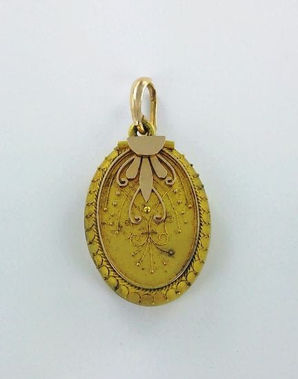 Pendentif médaillon or 750 millièmes, la bélière o
