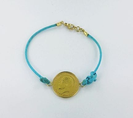 Moneta da mezzo sovrano del 1912 in oro su braccia