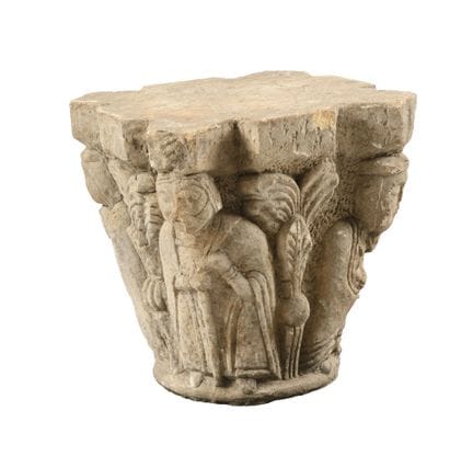 Carved stone CAPITEL depicting figures separated b