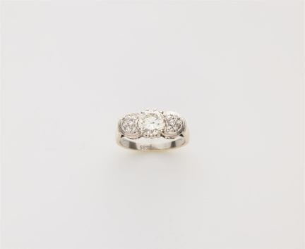 A rhodinated 14k yellow gold and diamond ring.

Mo