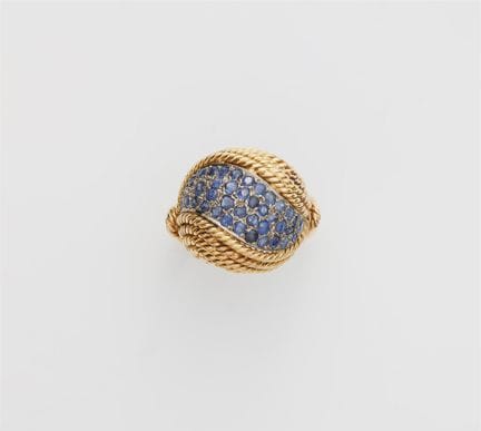 A braided 14k gold and sapphire dome ring.

Double