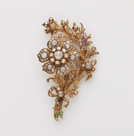 A 14k yellow gold coloured gemstone and foiled ros