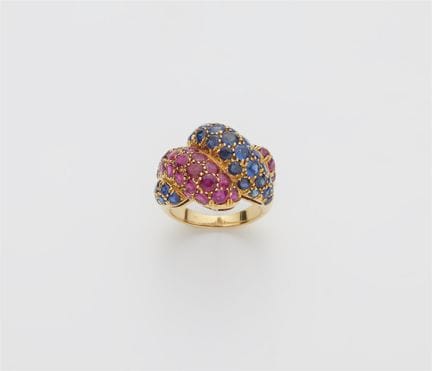 An 18k gold natural sapphire and ruby ring.

Front