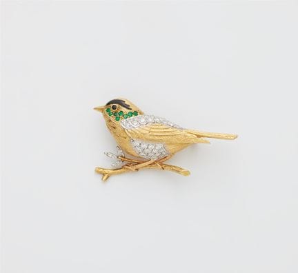 An English 18k gold enamel emerald and diamond nov