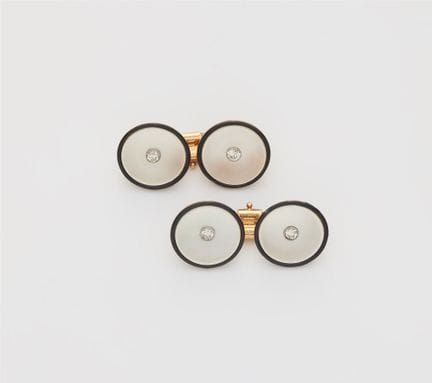 A pair of mother of pearl, black enamel and diamon