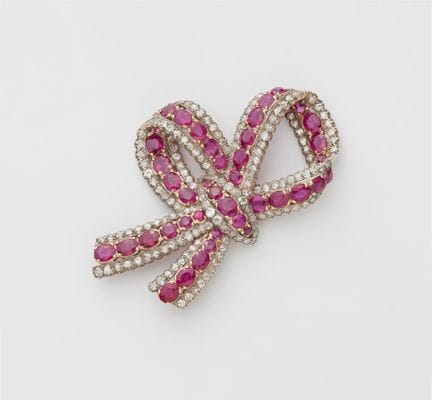 A 14k gold diamond and ruby Belle Epoque bow brooc
