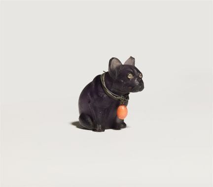 A frosted carved amethyst model of a sitting Frenc