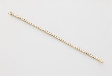 An 18k gold and brilliant-cut diamond line bracele