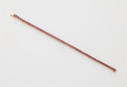 An 18k white gold and ruby rivière bracelet.

Flex