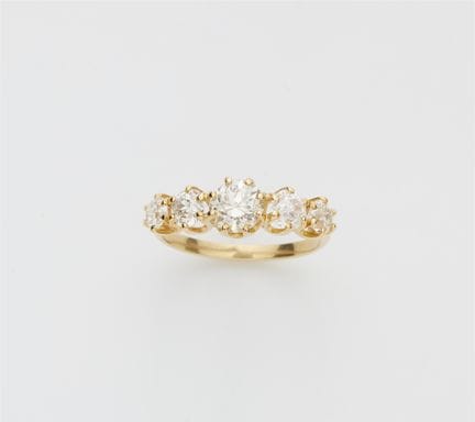 An 18k yellow gold and brilliant-cut diamond five 