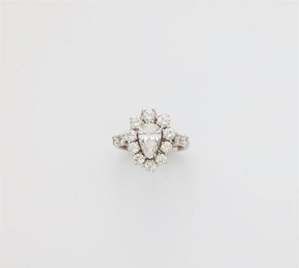 An 18k white gold and diamond cluster ring.

The s