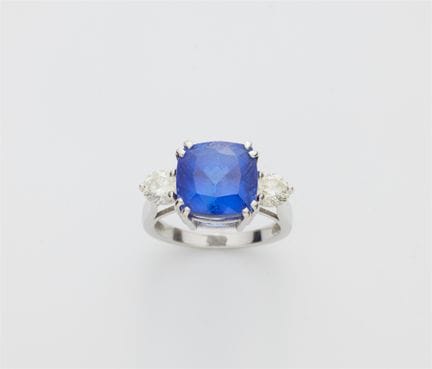 An 18k white gold diamond and cushion-cut tanzanit