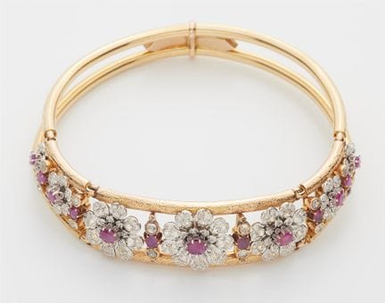 An 18k two colour gold old-cut diamond and ruby Re