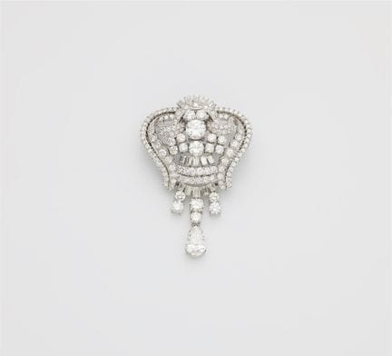 An opulent platinum and diamond cocktail brooch wi