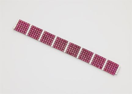 A platinum diamond and invisible-set ruby flexible