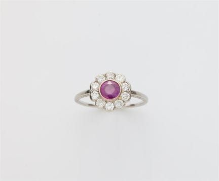 A platinum diamond and ruby Art Déco cluster ring.