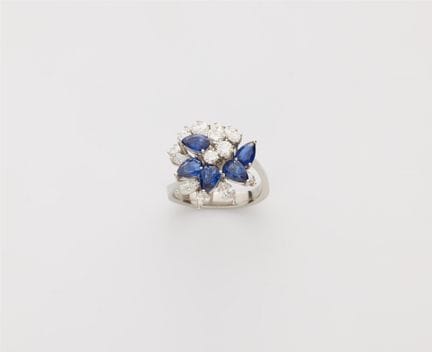 A platinum sapphire and diamond cocktail ring.

An