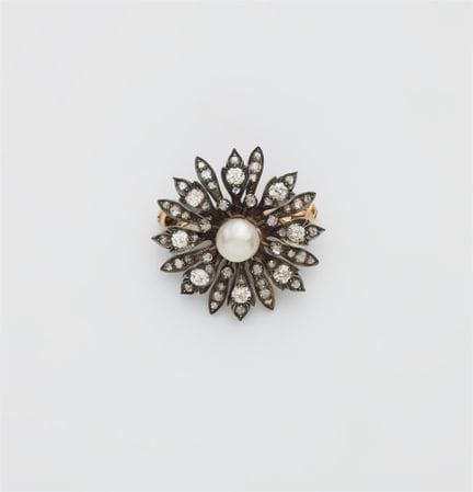 A 14k gold diamond and bouton pearl flower brooch.