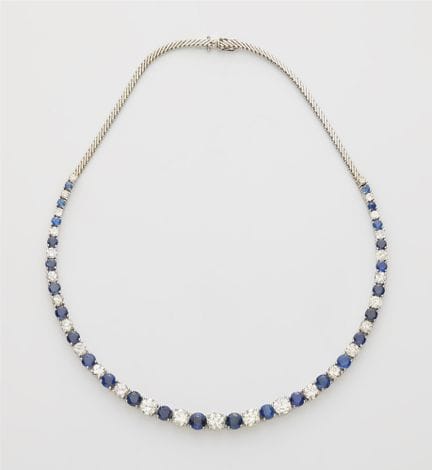 A flexible 18k white gold sapphire and diamond riv