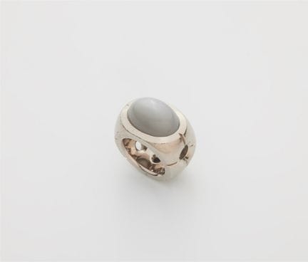 A solid 18k gold ring with a large grey moonstone.