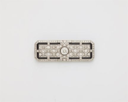 A platinum 18k gold diamond and onyx Art Déco broo
