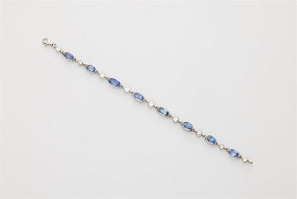 An 18k white gold diamond and sapphire bracelet.

