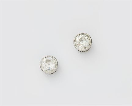 A pair of 18k white gold diamond solitaire ear stu