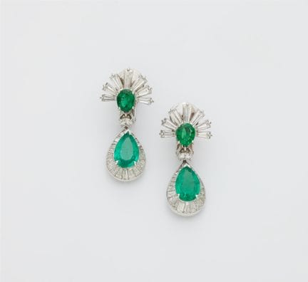 A pair of 14k white gold emerald and diamond penda