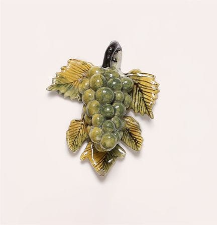 Grappe de raisin sur feuille de vigne

Faïence, dé