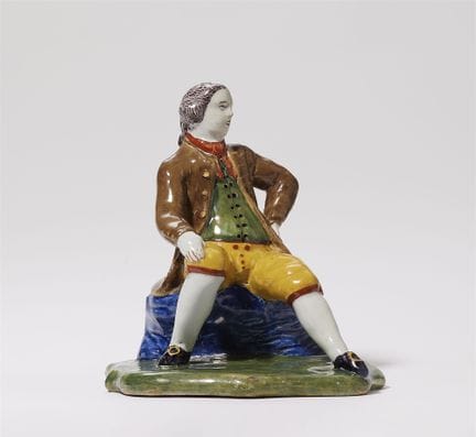 Rare figurine représentant un homme assis

Faïence