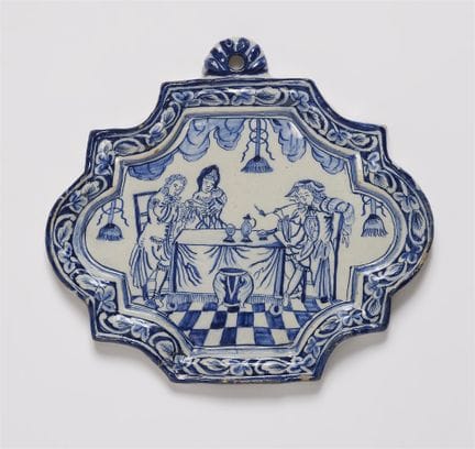 Petit plateau décoré d'une scène de genre

Faïence