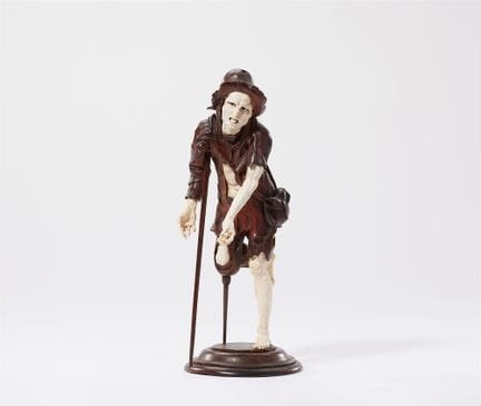 单腿倚拐杖而立的乞丐

象牙、果木、白玻璃和黑玻璃。这是一件由众多独立部件组装而成的全立体“组合雕塑