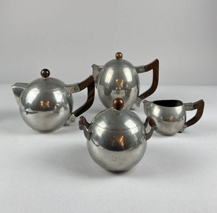 Spherical pewter tea set with rosewood handles and